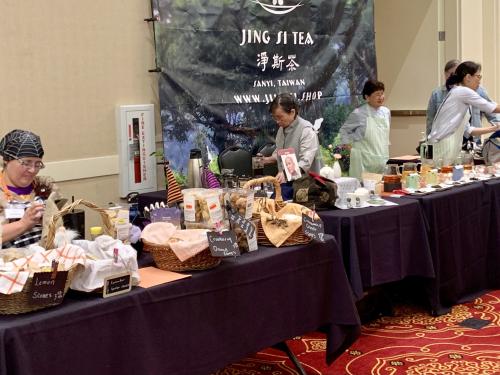 photograph of vendor booths covered in baked goods, tea, and tea wares at the Nevada Tea Festival